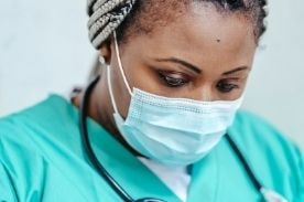 medical assistant looking down.