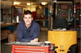 apprentice working in workshop.