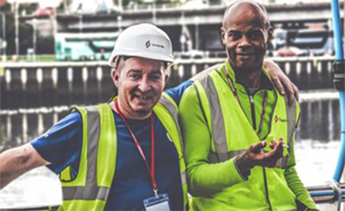 Two workers standing together.