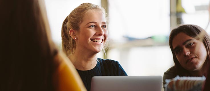 Woman smiling while studying.