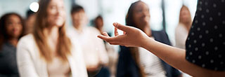 Person presenting to a class.