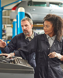 automotive technician working using a computer