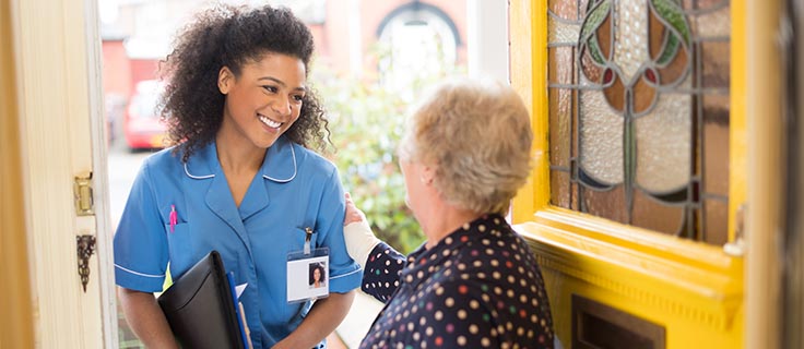 patient greets home nurse at front door
