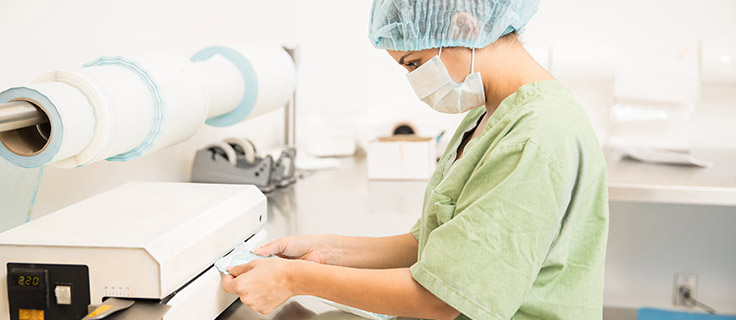 Sterile Processing employee at work in a lab.
